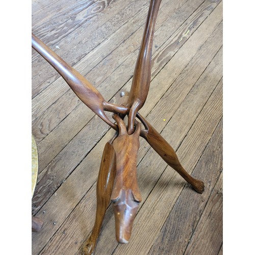 54 - Two folding tables with dog decoration on legs and a brass disc table top.