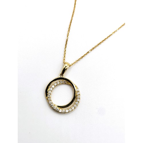 409 - A 9ct yellow gold diamond halo style pendant necklace (46cm), cased.