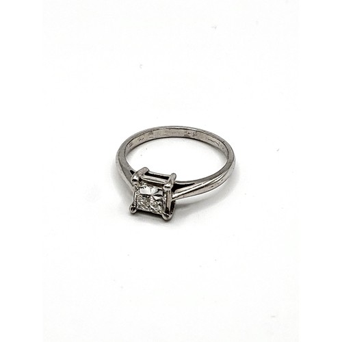 410 - A princess cut diamond ring approximately of 3/4 carat diamond set in white metal 2.9gms. Size L1/2