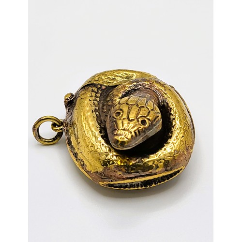 130 - A brass coiled snake vesta case 2.5cm x 4.5cm x 3.5m. 17.7gms.