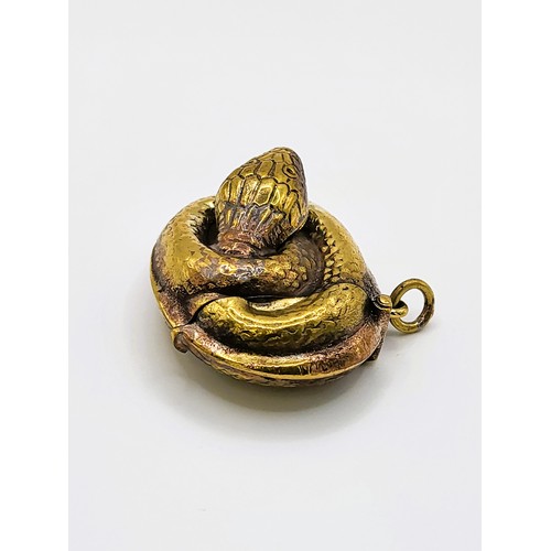 130 - A brass coiled snake vesta case 2.5cm x 4.5cm x 3.5m. 17.7gms.