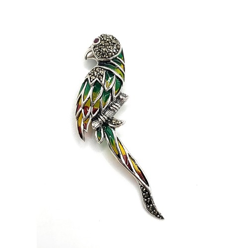 412 - A silver and plique de jour parrot brooch/ pendant 8cm x 3cm. 10gms.