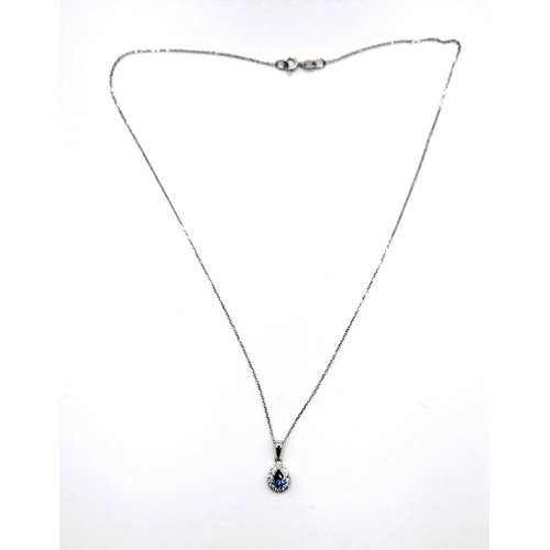 413 - An 18ct white gold pear shaped sapphire (less than 0.50 carat) and diamond pendant 1cm drop necklace... 