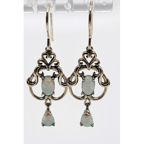 417 - A pair of silver and opal French hoop drop earrings in a Belle Epoque style, cased. 4cm drop x 1.5cm... 