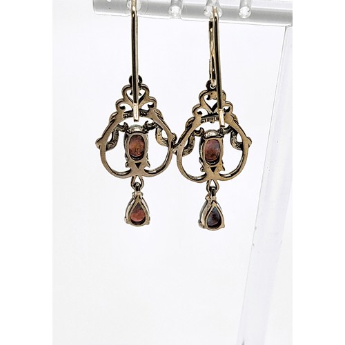 417 - A pair of silver and opal French hoop drop earrings in a Belle Epoque style, cased. 4cm drop x 1.5cm... 