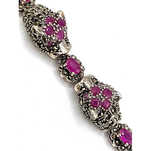 421 - A silver marcasite and natural ruby panther headed bracelet 19cm