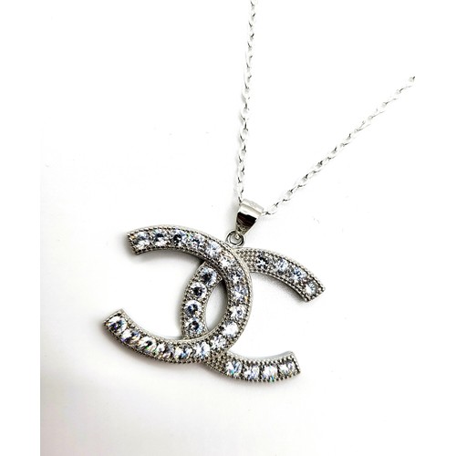 422 - A silver and cubic zirconia designer style trace link necklace  6.4gms. 44cm.