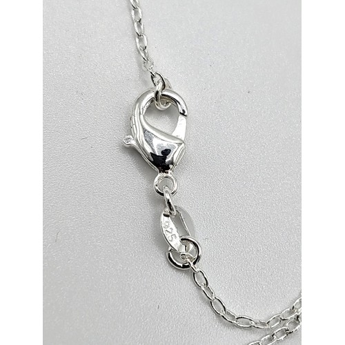 422 - A silver and cubic zirconia designer style trace link necklace  6.4gms. 44cm.