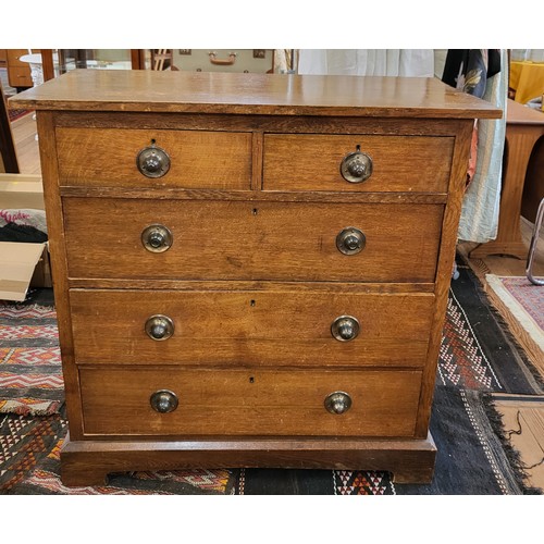 63 - An Oak chest of two  over three long drawers on bracket feet. 102cm x102 x50.