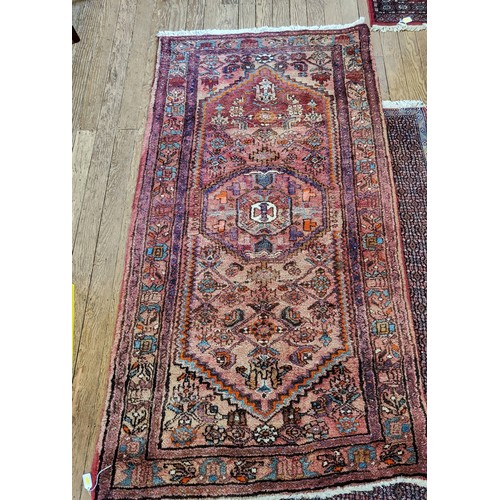 90 - A deep pile rug 108cm x 210cm.