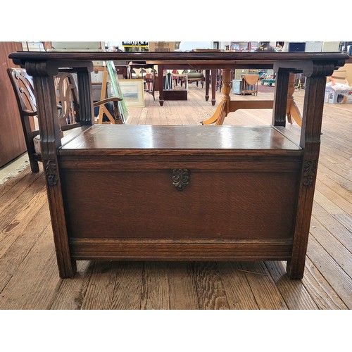 22 - A monk's bench. Top folds over arms to create a table top, seat lifts for storage. 92cm x 92cm x 48c... 