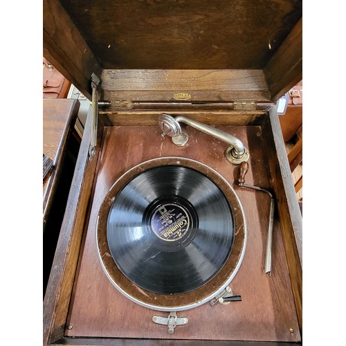 29 - A vintage oak cased clockwork Lissenola gramophone unit 85cm x 44cm x 49cm. Lift top to reveal the g... 