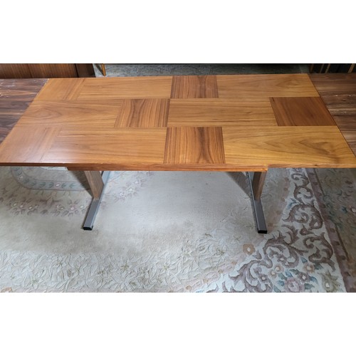 36 - A mid-century extending coffee table 58cm x  65cm x 135cm 195cm when extended. Leg repaired and both... 