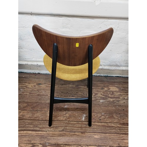 39 - A G Plan 'Butterfly' chair with mustard colour seat and black legs.