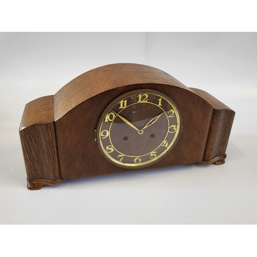 66 - A 1940's Art Deco-style mantle clock with gold fittings. 23cm x 46cm.