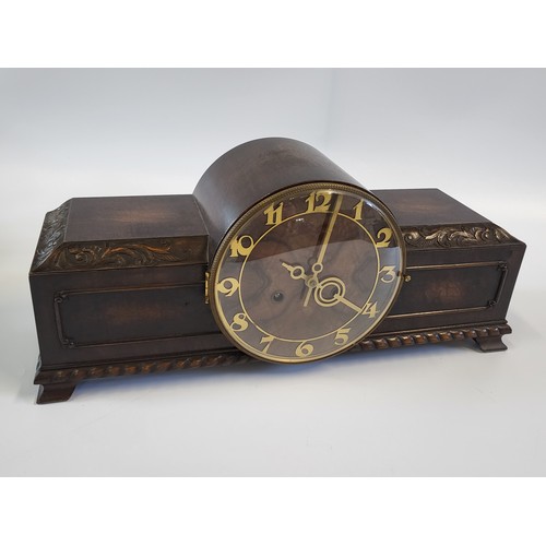 67 - A 1940's Art Deco- style mantle clock with gold details. 21cm x 50cm.