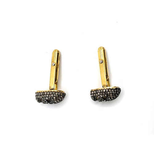 364 - A pair of gold-plated silver skull cufflinks set with rose cut diamonds. Diamonds approx. 1.80ct.