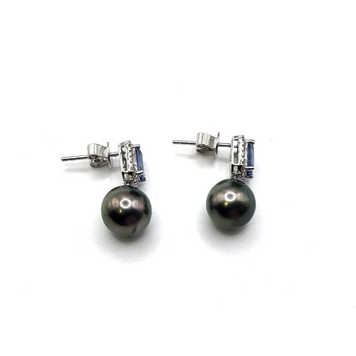 394 - A pair of black pearl, step cut sapphire and diamond drop earrings, boxed. Sapphires 1.41ct approx. ... 