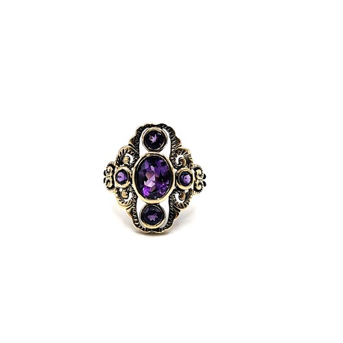 397 - A 9ct yellow gold amethyst Art Deco style ring size N 4gms