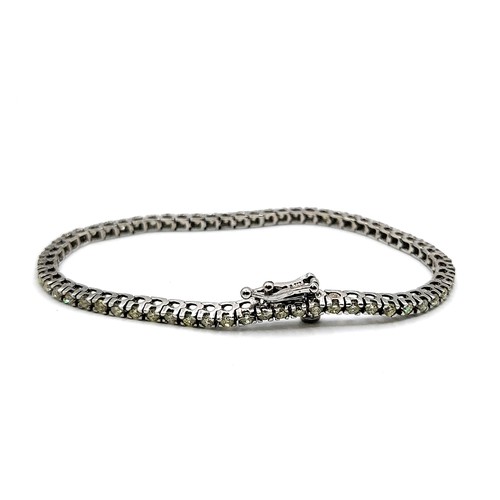 403 - A 14ct white gold diamond tennis bracelet of approximately 2.8cts 9.4gms. 18cm