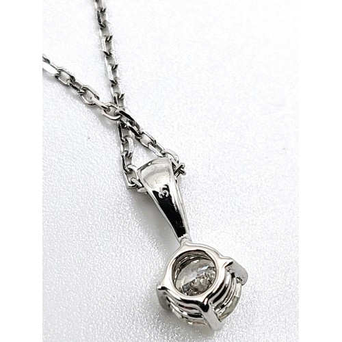 405 - A 9ct white gold and diamond single stone pendant trace link necklace of 30 points. 1.5gm. 44cm.