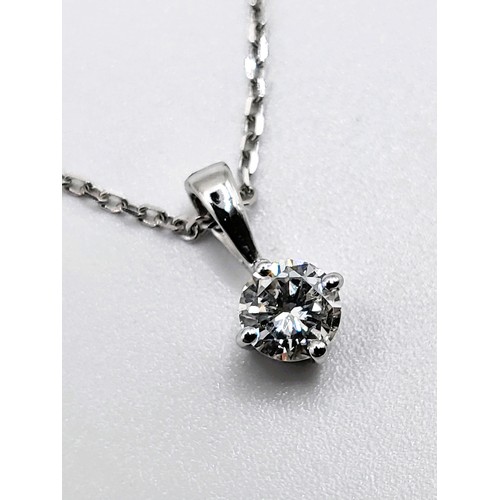 405 - A 9ct white gold and diamond single stone pendant trace link necklace of 30 points. 1.5gm. 44cm.