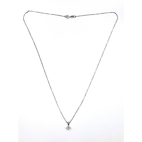 405 - A 9ct white gold and diamond single stone pendant trace link necklace of 30 points. 1.5gm. 44cm.