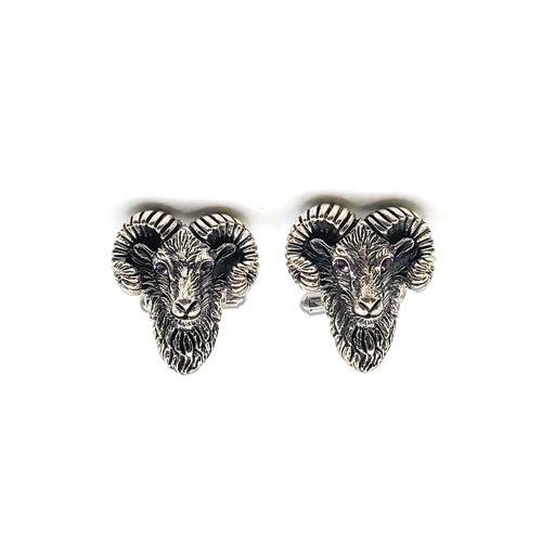 406 - A pair of silver (stamped sterling) rams headed cufflinks 13.1gms 2.5cm x 2cm.