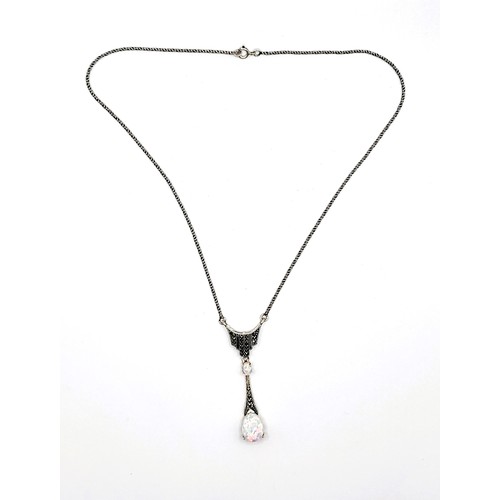 409 - A silver (stamped 925) marcasite and opal  pendant 6cm drop on a silver (stamped 925) rope chain 40c... 