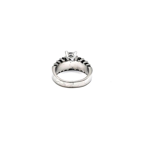 410 - A 14ct white gold (stamped) diamond dress ring, with a central approximately 1.0ct princess cut diam... 