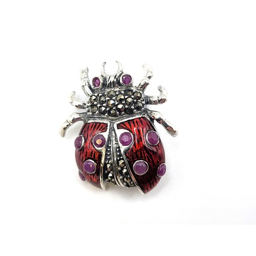 411 - A silver (stamped 925) and enamel ladybird brooch/pendant. 6.3gms 3cm