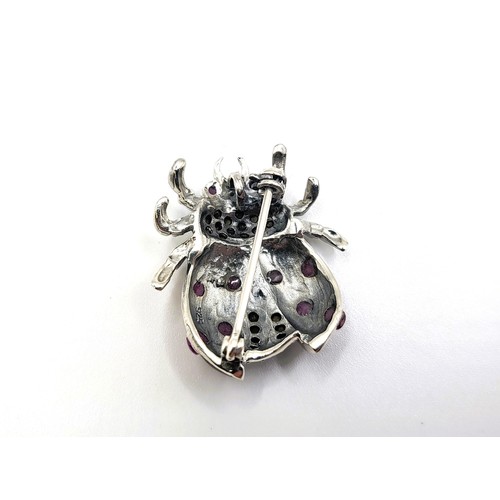 411 - A silver (stamped 925) and enamel ladybird brooch/pendant. 6.3gms 3cm