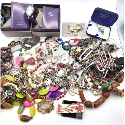 415 - A large bag of costume jewellery consisting of brooches, earrings, and necklace, and two boxed unuse... 