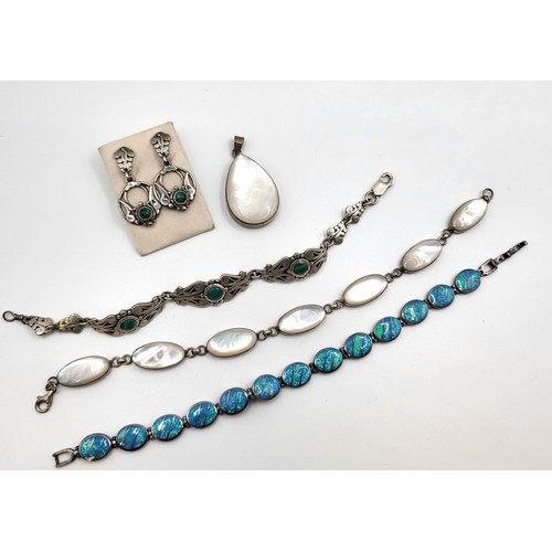 427 - A collection of bracelets including mother of pearl set in silver with a matching pendant, a faux op... 