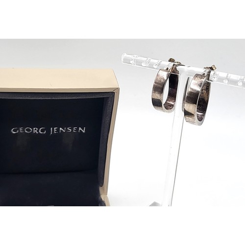 428 - A Georg Jensen pair of silver D-shaped hooped earrings, boxed. 109gms. 2.5cm drop (0.7cm width)