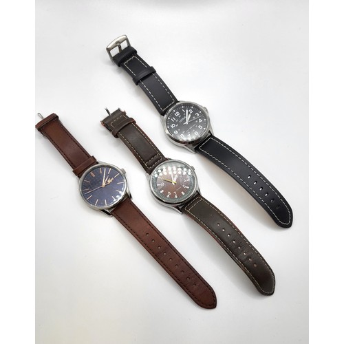 440 - Three gentlemen's watches, a quartz Lacoste, a Lorus Diver's watch (Resist 100 meters) and a Sekonda... 