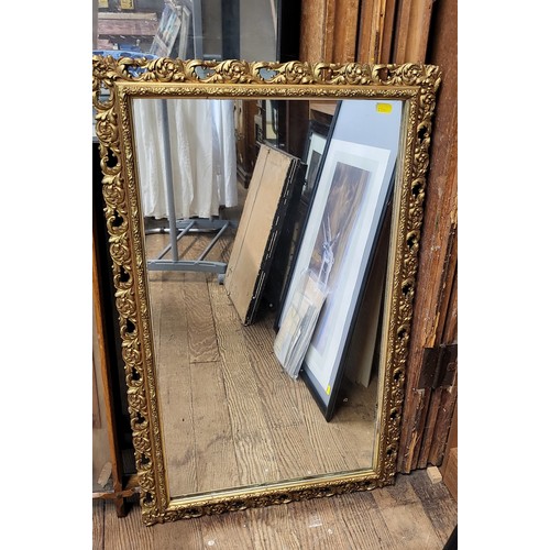 19 - An ornate gilt mirror 85cm x 53cm.