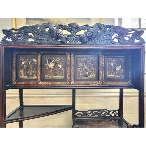 22 - A Chinese ornately carved and decorated display unit. 168cm x 71cm x 25cm.