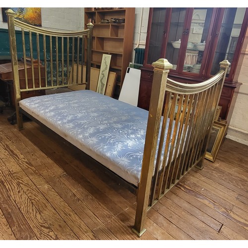 29 - A Victorian brass bed frame and sprung mattress. 140cm x 110cm x 190cm.