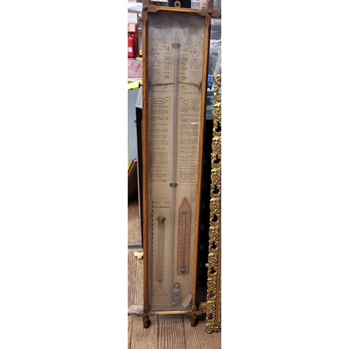 39 - An antique oak barometer 107cm x 28cm.