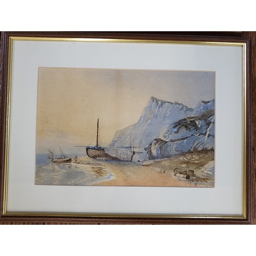 98 - A pair of watercolours: a coast scene with boats, and a river and town scene. Unsigned. Framed and g... 