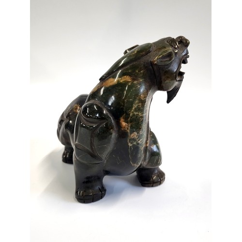 109 - A Jadeite dark green tiger 15cm in height