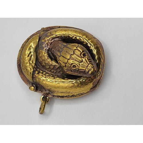 122 - A brass cased snake vesta, 4cm x 3.5cm. 17.6gms