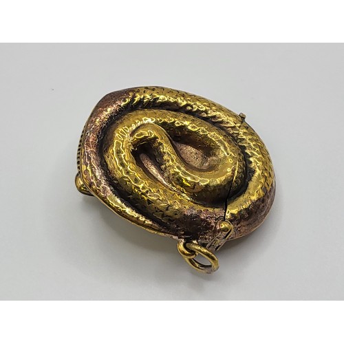 122 - A brass cased snake vesta, 4cm x 3.5cm. 17.6gms