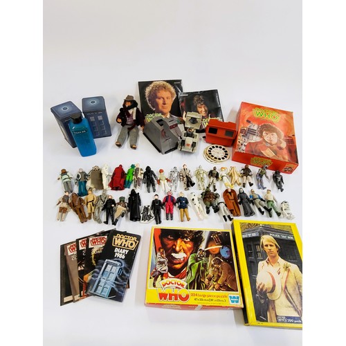 141 - A collection of Dr Who and Star Wars memorabilia including Dr Who magazines, cassettes, jigsaw puzzl... 