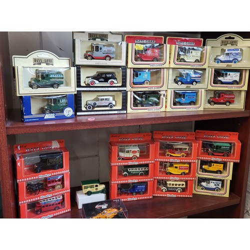 144 - Twenty-seven Lledo Days Gone diecast commercial vehicles including Texaco, Esso and hamley's in wind... 