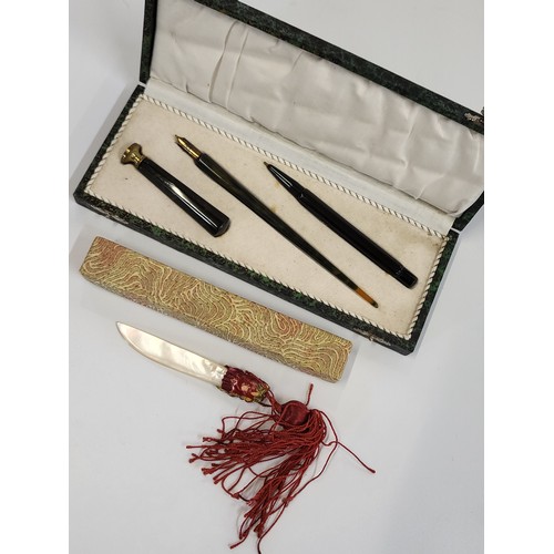 178 - 1920 quill pen, blotting stamp and pencil in original case, and a mother of pearl letter opener.(4)