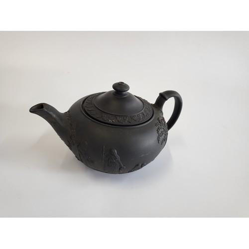 232 - Wedgwood black basalt tea pot and cover 21cm diameter.