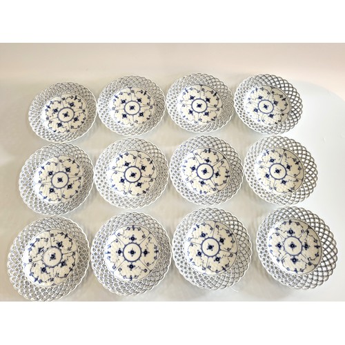 246 - Twelve Copenhagen pierced blue and white plates with pierced cavetto. (12)