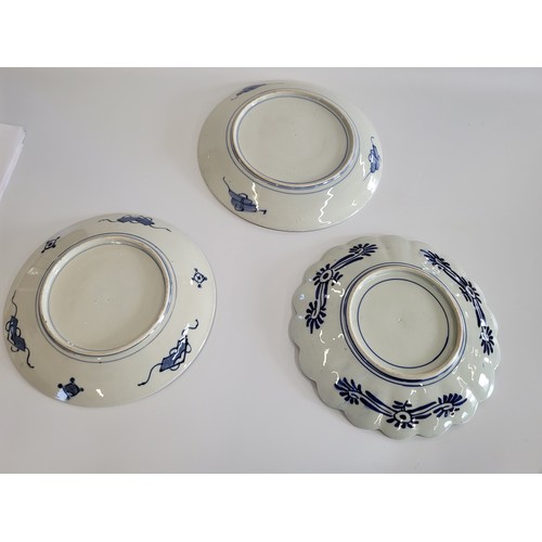 256 - Three Japanese porcelain Arita dishes, one with lobed rim 31cm to 34cm. (3)